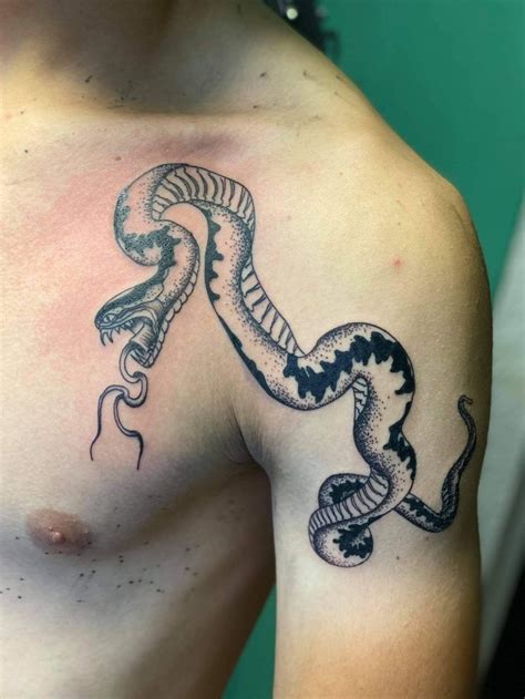 Symbolic Snake Tattoo: Breast Between with Deep Meanings